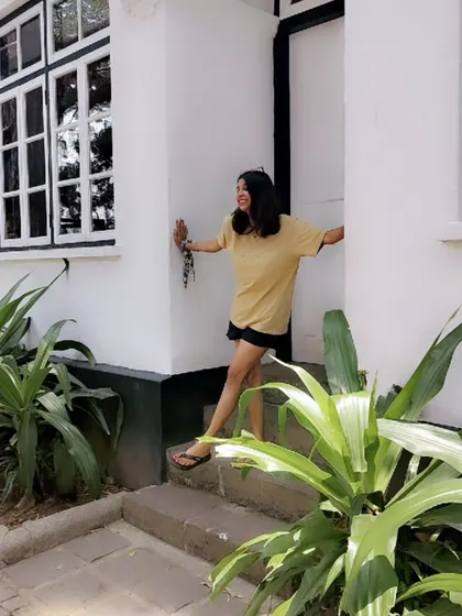 A candid moment during my Kerala trip. A simple yellow t-shirt and black shorts are perfect for a day of exploring in comfort.