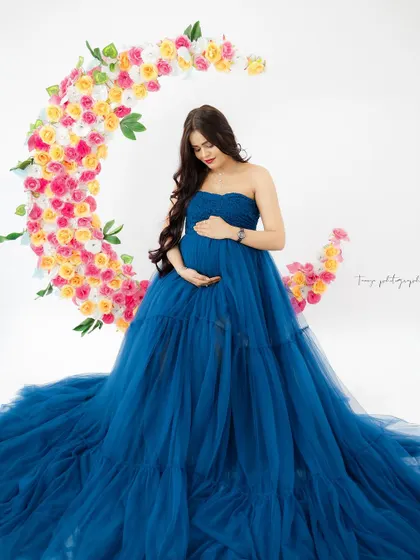 A duplicate of image 283, this creative portrait on a floral moon with a deep blue tulle gown is simply magical.