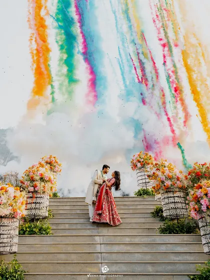 The climactic moment of the engagement ceremony, with colorful smoke creating a spectacular backdrop. I coordinate special effects like this to make your key moments truly cinematic.