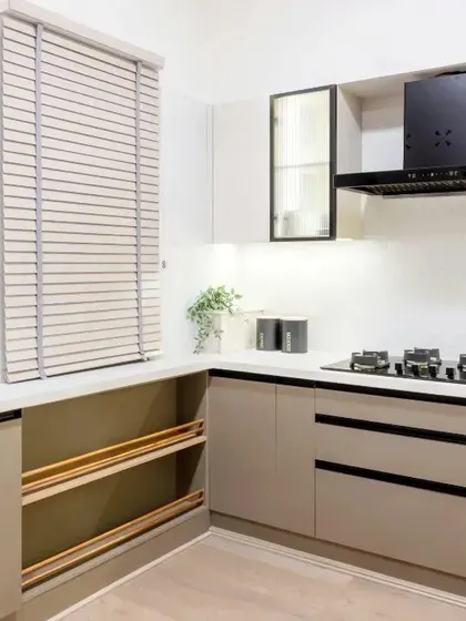 A functional and stylish kitchen in dark beige and white. I used fluted glass on some cabinets and open wooden racks for vegetable storage to maximize efficiency.