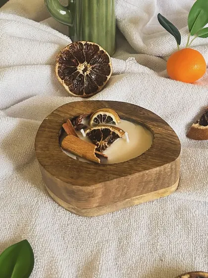 A beautifully styled shot of my autumn-themed candle, perfect for creating a cozy atmosphere.