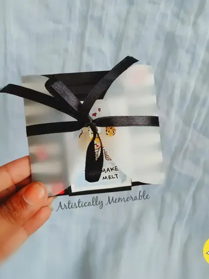 The "You make me melt" card all wrapped up with a black ribbon, ready to be tucked into a special gift box.