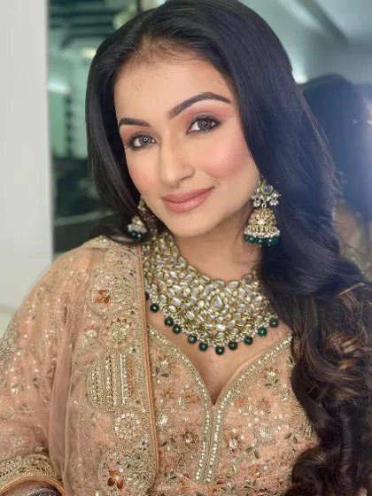 This image showcases the beautiful, bouncy curls that complement the soft makeup. My hairstyling classes cover a range of techniques for creating voluminous hair.