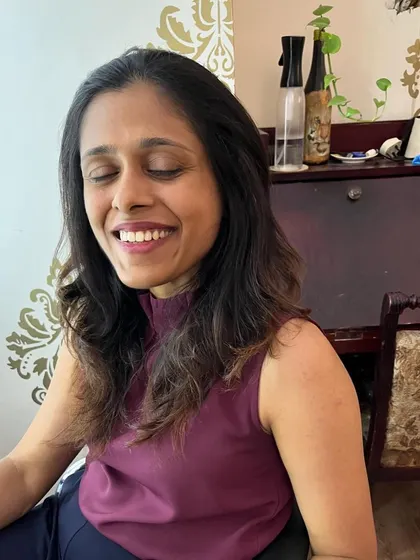 A happy client with her new face-framing cut.