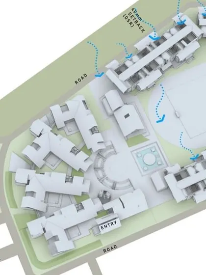 A 3D site plan illustrating how the campus orientation at Vellore International School is designed to capture the sea breeze from the east for natural ventilation.