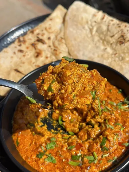 A close-up of a spoonful of my Paneer Bhurji, showing its rich texture and color.