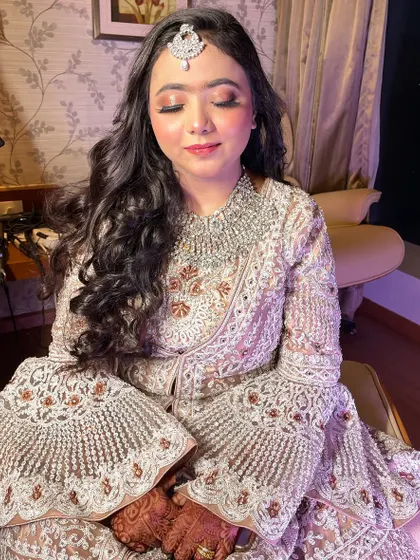 Make way for our gorgeous bride Farheen, dolled up for her reception. We created a soft, glowy makeup look that enhances her natural beauty.
