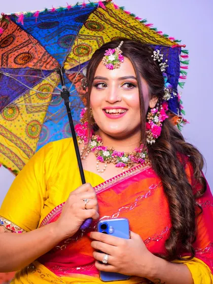 Another fun shot with the umbrella, capturing the bride's happy and carefree spirit during her Mehendi.