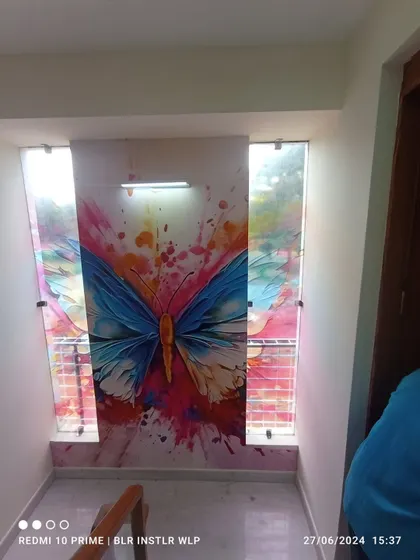 A closer view of the colorful butterfly mural on the staircase.