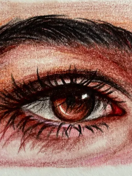 A close-up of my first attempt at drawing a realistic eye with color pencils. I loved blending the colors to create depth and emotion.