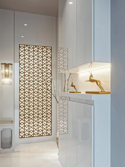 A beautifully designed entryway featuring a backlit jali panel. The niche with illuminated decor adds a touch of elegance and provides a stylish space for displaying personal treasures.