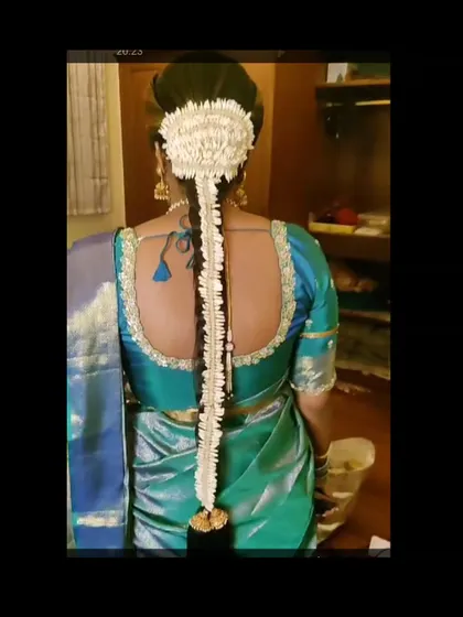 A traditional 'Jadai' made entirely of white flowers, offering a delicate and fragrant option for a bridal hairstyle.