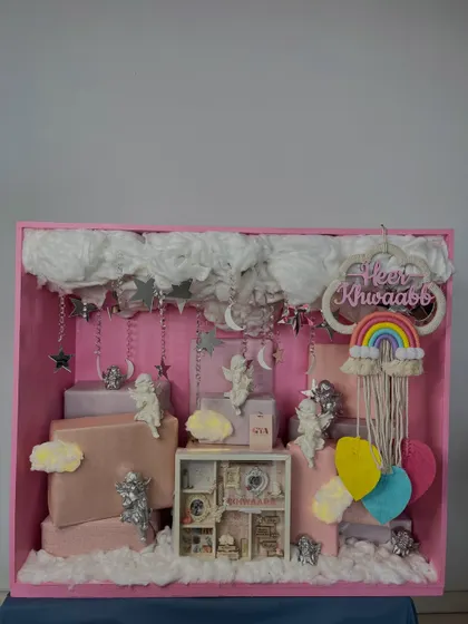 A straight-on shot of the beautiful pink 'Heer Khwaabb' hamper, showing the balanced and artistic composition.