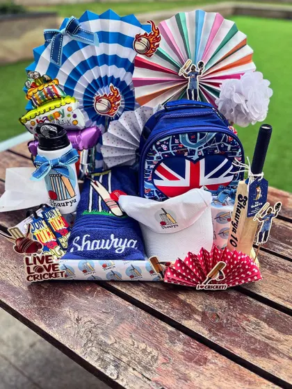 For a little champion's birthday, I created this cricket-themed world of joy. Every detail, from the personalized bat and cap to the sporty color palette, was curated to bring his childhood dream to life. I believe kids' gifts should be as imaginative as they are.