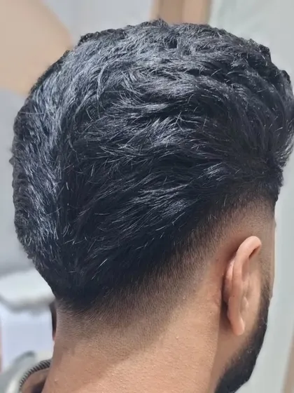 The back view of the classic men's haircut, showing the expert tapering.