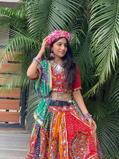 The same multi-colored outfit, this time styled with a pagdi for a unique and powerful look.