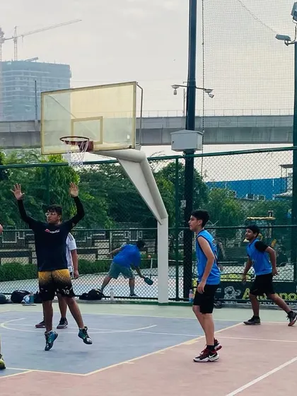 A player prepares to take a shot while a teammate sets a screen.