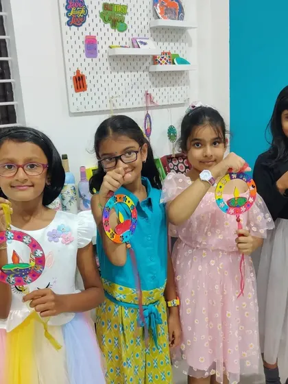 More proud artists with their finished Diwali hangings! It's a wonderful take-home craft from a festive workshop.