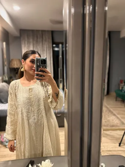 A mirror selfie in a beautiful off-white chikankari anarkali. This is my go-to for the start of the Diwali season.