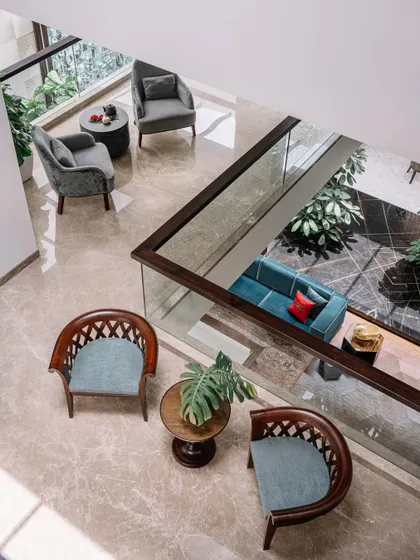 This top-down view shows how different seating areas are arranged across levels to create both connection and privacy. You can see the flow of the home, from the formal seating on the upper level to the more casual living space below, all connected by the open courtyard.