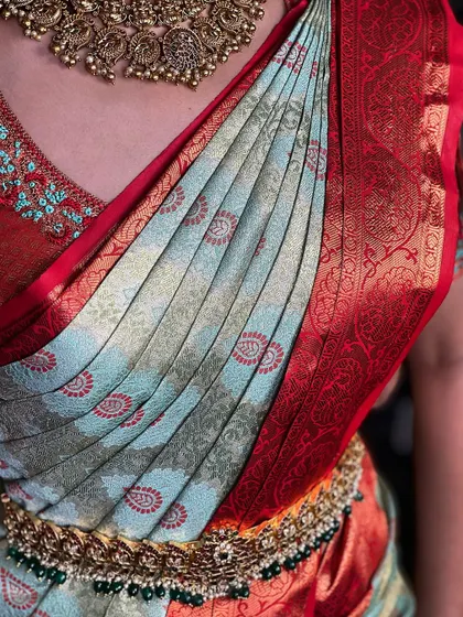 A close-up of the saree pleats and the rich texture of the silk. This is the level of detail I focus on for every client.