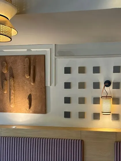 The terracotta textured piece installed in its custom-built niche at the Sidewalk cafe in Agra.