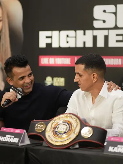 A moment of camaraderie between promoters at the press conference.
