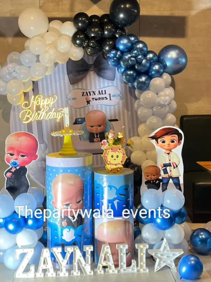 The same stylish Boss Baby setup, showing the full balloon arch and character cutouts. It's a modern and fun take on the popular theme.