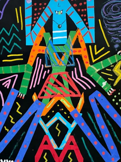A student's name transformed into a vibrant, symmetrical monster. This project teaches the principles of symmetry and self-expression through letterforms.