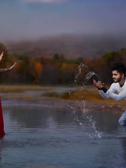 A fun and playful moment from a pre-wedding shoot at a lake. I encourage couples to interact naturally, allowing me to capture genuine moments of joy and connection like this water splash.