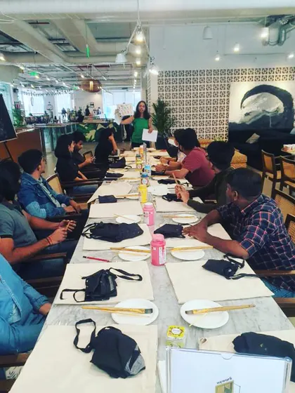 Setting up for a tote bag painting workshop. I provide all the materials and guidance to ensure a smooth and enjoyable creative experience for everyone.