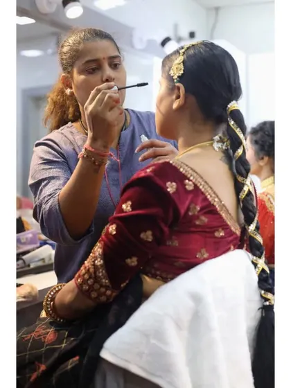 Here, a student is practicing mascara application on a model for a traditional look. We ensure they get comfortable working on real clients.