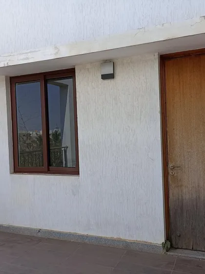 The original utility and balcony area before we broke down the wall to create the home office.