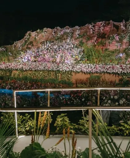 A closer look at the bridge and floral arrangements on the reception stage. Every detail was hand-picked and personally overseen to ensure a flawless execution.