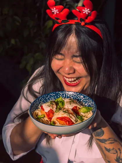 Pure joy and festive flavors. A guest delights in a dish from our Christmas menu, capturing the happy and indulgent spirit of the season at Roxie.