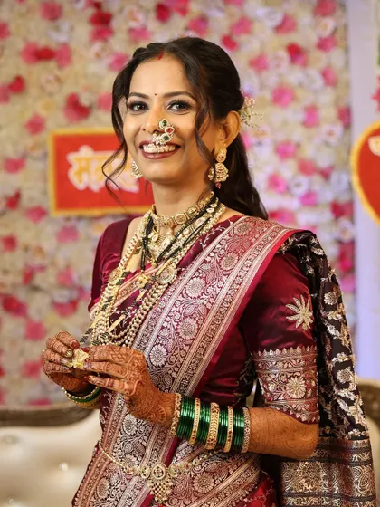 The same radiant reception look, capturing her happy smile. We ensure our brides feel comfortable and beautiful, allowing their true personalities to shine.