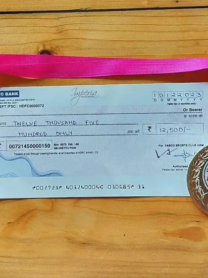 The prize check and runner-up medal from the Goa River Marathon. The rewards of a well-run race.