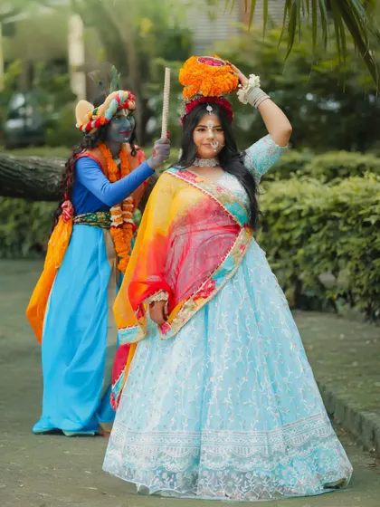 A playful and vibrant Radha-Krishna look. This is a popular theme that allows students to practice colorful and expressive makeup.