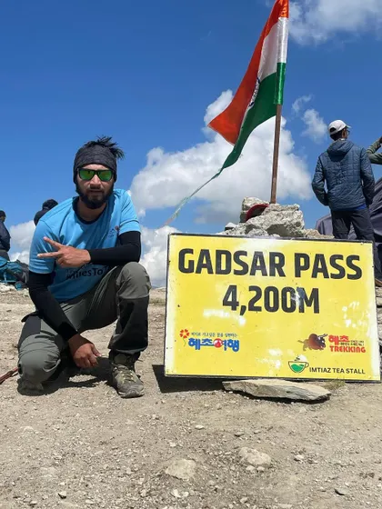 A proud moment at Gadsar Pass, standing at 4,200 meters on the Kashmir Great Lakes trek. Reaching these high passes is a major achievement for every trekker.