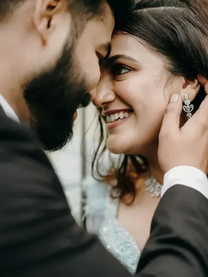 The beautiful smile she gives him. Capturing these little glances is key to my style of heart-winning photography.