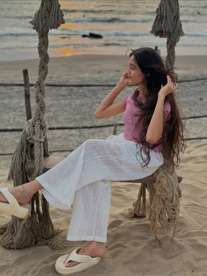 A relaxed pose on a beach swing. We find the most Instagrammable spots for you to capture your travel memories.