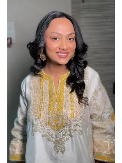 An elegantly understated look for an intimate at-home gathering. The makeup is minimal and soft, perfect for a relaxed yet special occasion.