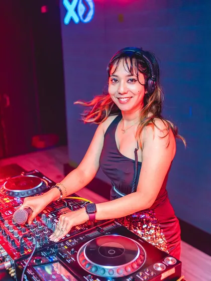 A smile on my face and my hands on the Pioneer decks. This is me in my element, ready to mix the perfect set of Punjabi and Bollywood tracks for a club night.
