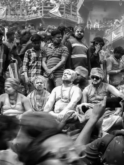 A black and white photo series from Masaan Holi. These images strip away color to focus on the raw emotion, the crowds, and the stark spiritual power of this unique festival.