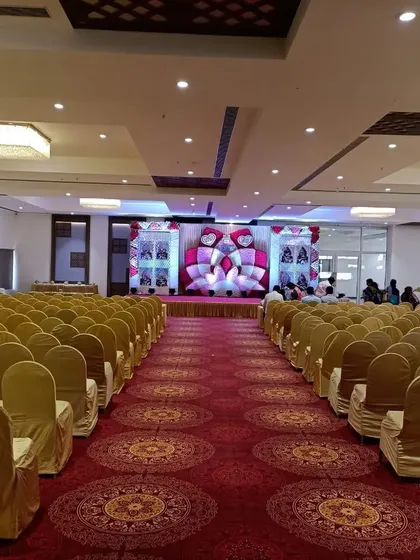 A view down the main aisle of Balaji banquet hall in Panvel. The hall is set up with theatre-style seating, perfect for wedding ceremonies and receptions.