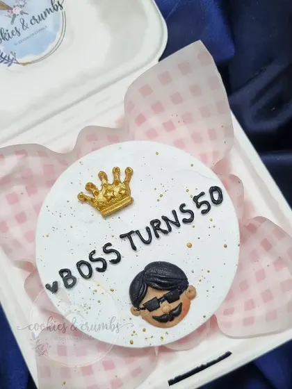 This bento cake was for a 50th birthday, celebrating the "Boss." The little fondant crown and cool caricature add a fun, personal touch.