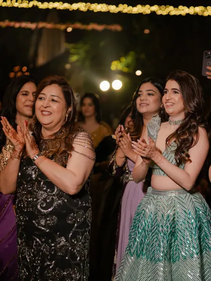 Guests clapping and cheering on the performers, showcasing the lively and engaging atmosphere of our events.