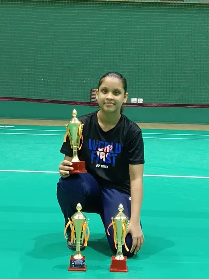 Saanvi Audi with her triple crown trophies from the All Goa state ranking tournament, winning U15 singles, doubles, and mixed doubles.