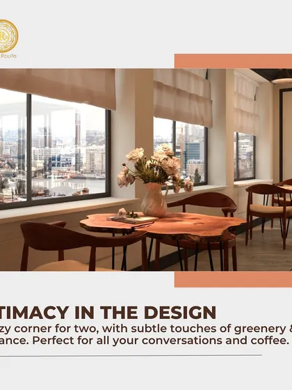 Intimacy in the design. This cozy corner for two, with its natural wood table and view of the city, is perfect for conversations and coffee.