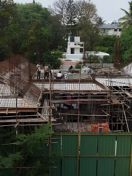 This drone shot captures the progress of the Japanese-inspired home, showing the relationship between the different roof structures and the surrounding landscape. Our site management includes overseeing the project from all angles.